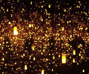 golden flickering lights that seem to extend into an endless black voic