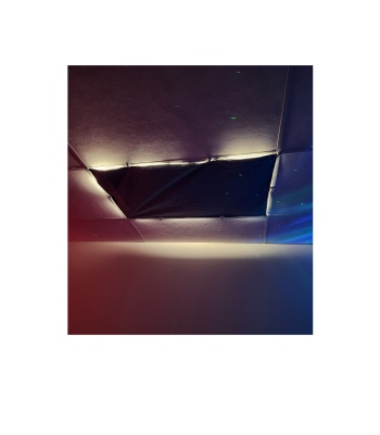 A dark blue cover fastened over florescent lights on a ceiling. There is a small amount of light peeking through.