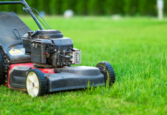 photo of a lawnmower on green grass