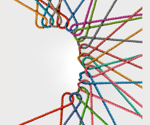colorful twine tied together forming the profile of a face in the negative space